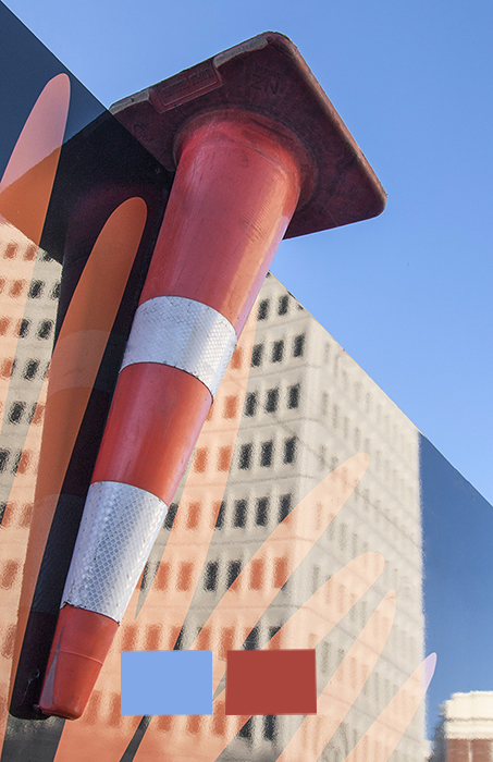 An upside down traffic cone on a wall - understanding color in photography